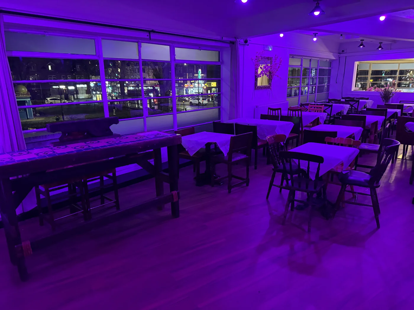 The room and open floor under purple evening lighting.